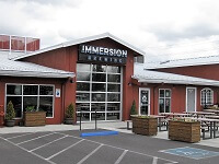 Immersion brewer outlet